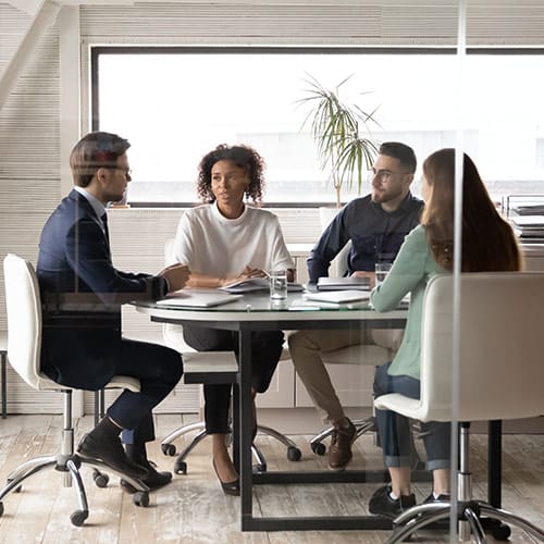 Group of business people in a conference room talking