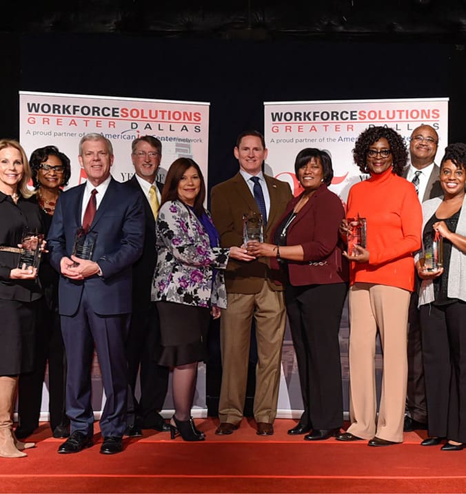 Workforce Solutions Greater Dallas Board Members and Staff posing for a group photo with awards.